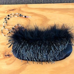 Satin beaded and feathery evening bag.